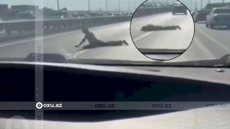 Bakıda kişi yola uzanaraq başını asfalta çırpdı - Video